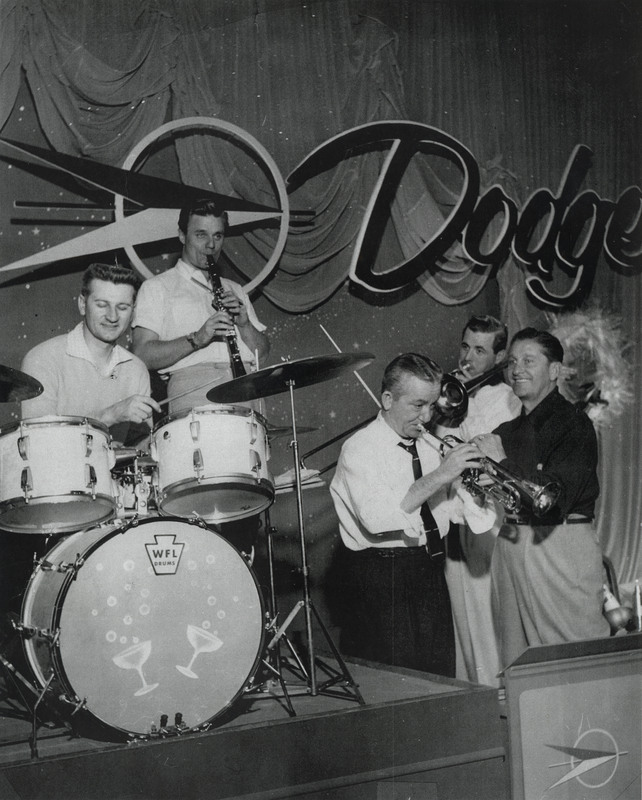 Red playing with a band